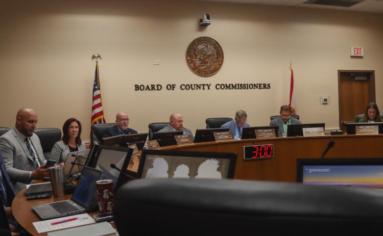 The Board of County Commissioners prepares for its Aug. 11 meeting. Photo by Ashley Chandler/News-Leader