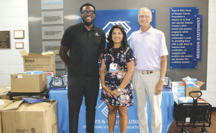 Shilpa Amin M.D., Bill Austen, and Landward Griffin in front of the donation table. Photo by Marisa DeMar/News-Leader