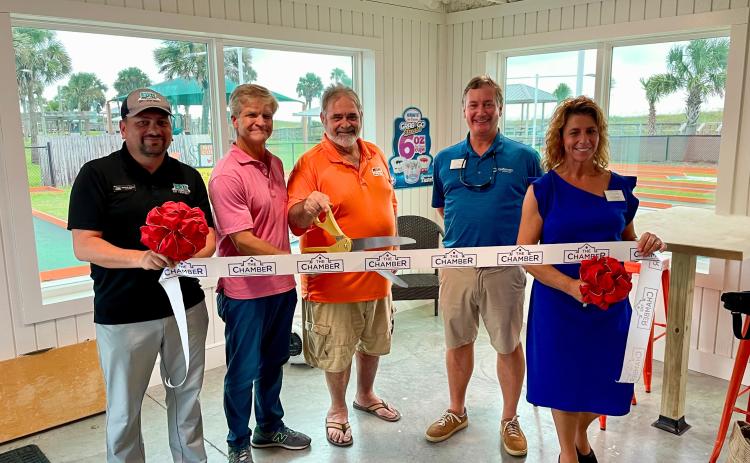 Owner Tom Miller, Manager Greg Vadnais, and Nassau County Chamber members cut the ceremonial ribbon Monday at Putt-Putt Amelia Island.  Submitted Photo by Allyson Myrick 