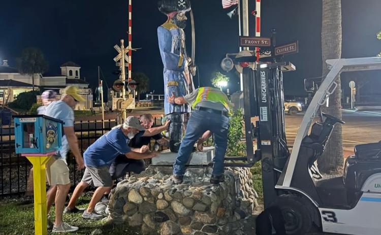Photo courtesy of City of FB Facebook page Members of the Fernandina Pirates Club and the city move Peg Leg Pete at the crack of dawn Thursday.