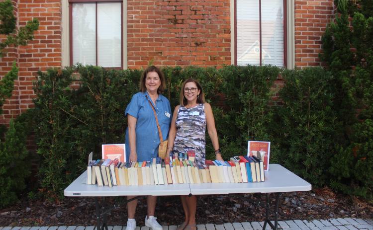 Claudia Zane and Mary Kay Lundy in front of the book swap table at the FOL book swap on Sept. 30 Photos by Marisa DeMar/News-Leader