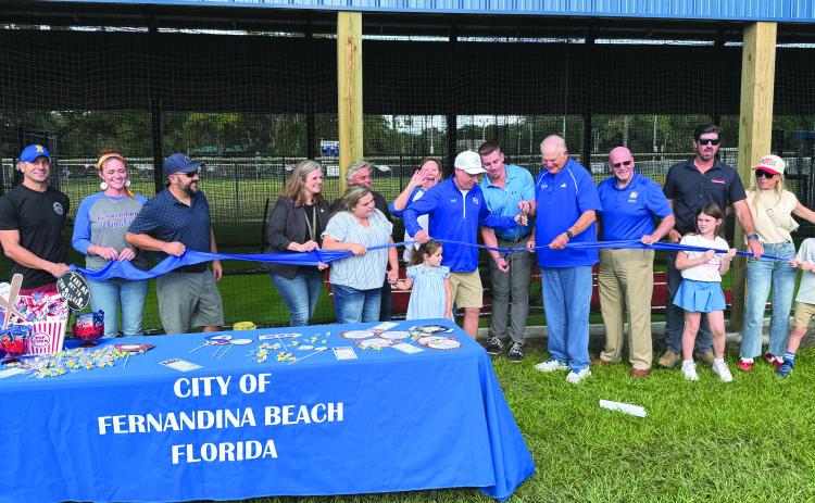Officials cut the ribbon last week on batting cages at Central Park.