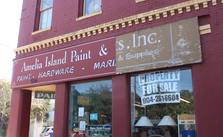 Amelia Paint Inc's closing sign hangs on the storefront on Ash Street in Fernandina Beach on Oct 23.  Marisa DeMar/News-Leader