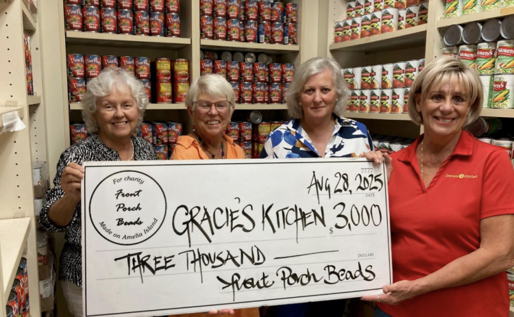 From left: Lucy Bryan, Debbie Pakradooni, Front Porch Beads President Frances Peters and MaryEllen Crocker during a $3,000 check presentation to Gracie’s Kitchen. Submitted by Dan Groth