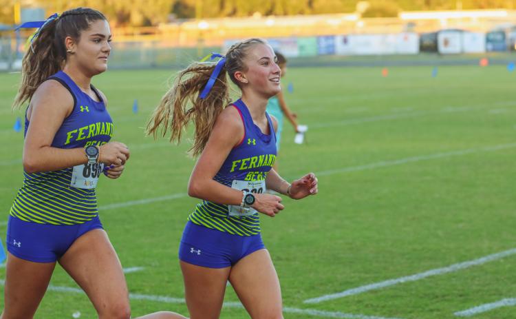 Mikaela Nichols and Grace Scuderi head to the finish line during Wednesday's race. Nichols in front with a 21-minute and 46.6-second time to Scuderi’s 21 minutes and 46.9 seconds. Photo by Ashley Chandler/News-Leader