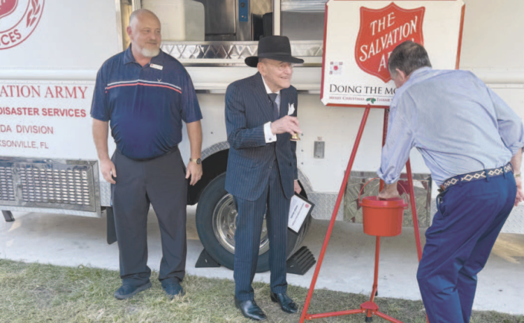 Richard Thompson, Buddy Jacobs and Geoff McKisson kick off the Salvation Army’s Red Kettle campaign. Jacobs rang the ceremonial first bell. Nick Blank/News-Leader