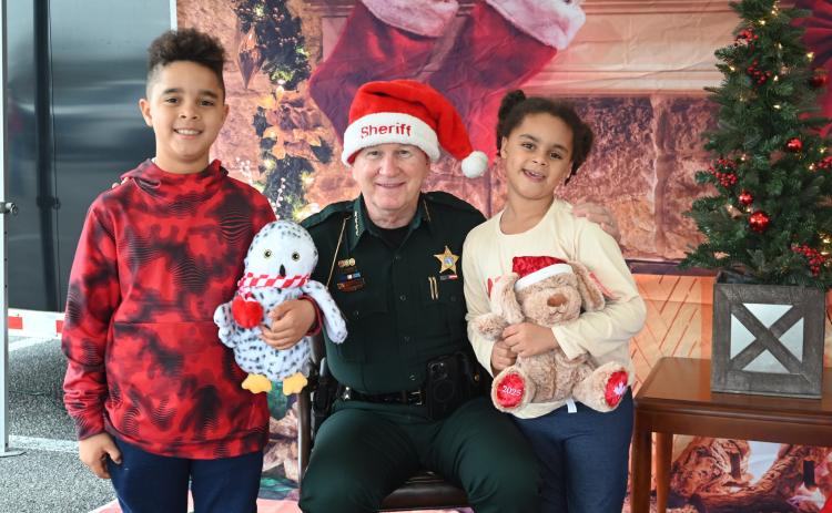 Submitted photo / Nassau County Sheriff Bill Leeper greets children during NCSO's Santa with a Cop event.