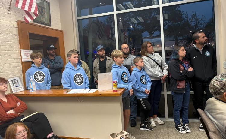 Amelia Island Youth Soccer Players and coaches gather at the Town Hall meeting at the City of Fernandina Beach City Hall.  By Marisa DeMar/News-Leader 