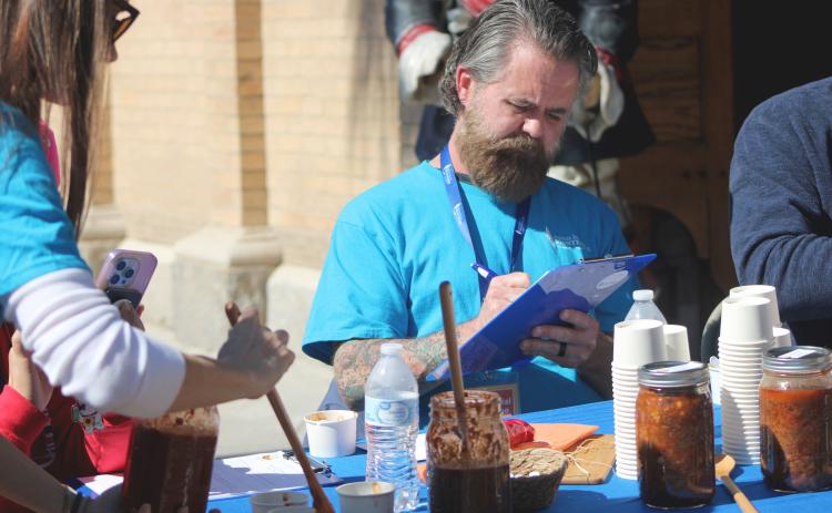 David Nunimaker judges at the Amelia Island Montessori School's 17th annual Chili Cook-Off. By Marisa DeMar/News-Leader