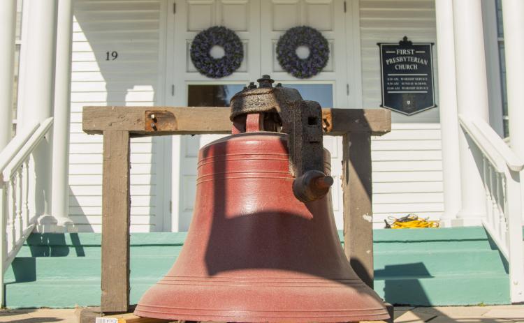 Workers from White’s Clock & Carillon removed the bell from the belfry at First Presbyterian Church on 6th Street in downtown Fernandian Beach. The bell was first hung in 1859. Photo by Ashley Chandler/News-Leader