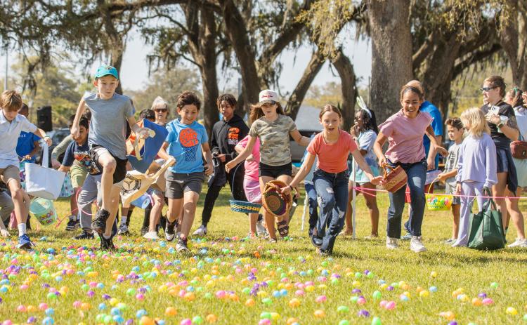 Thousands of colorful plastic eggs were scattered at Central Park on Saturday for local children to gather as part of Fernandina Beach’s second annual Easter Egg Hunt. Photo by Ashley Chandler/News-Leader