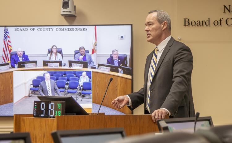 Ron Whitesides, of Purvis, Gray & Co., presents Wednesday to the Board of County Commissioners on the companies’ most recent audit of the BOCC and constitutional offices. Photo by Ashley Chandler/News-Leader