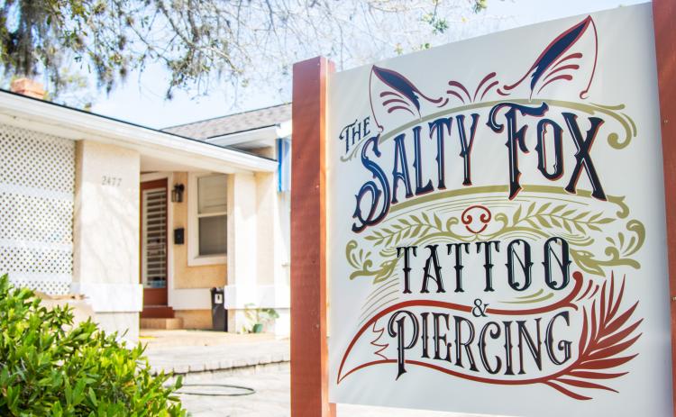 The new logo on the sign outside The Salty Fox Tattoo and Piercing. Photo by Ashley Chandler/News-Leader
