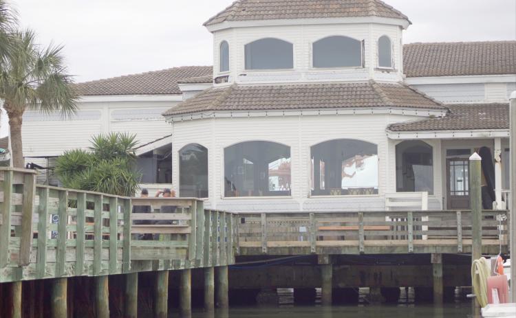 A view of the former Brett’s Waterway Cafe across the pier Thursday. Marisa DeMar/News-Leader