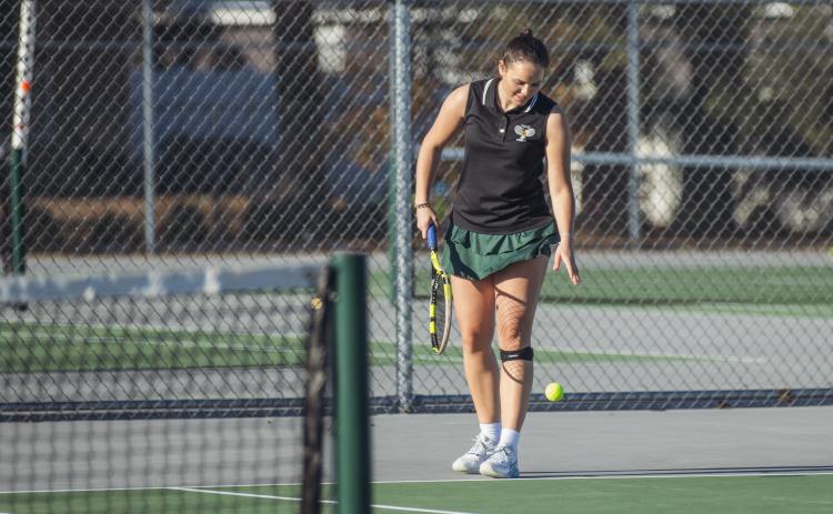 Magdalena (Magda) Urbanowicz prepares to serve in a February match at Yulee High School. Photo by Ashley Chandler/News-Leader