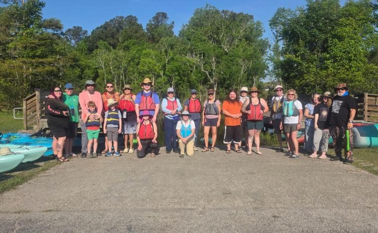 A group of volunteers paddled Lofton Creek to clean up litter during the annual St. Marys River cleanup event.