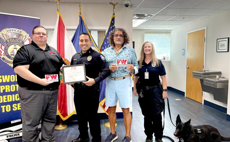 Derek Collins, FPBD Chief Jeff Tambasco, Paul Lore, Officer Tina Smith, and police dog Hanna. Derek Collins, the Regional Programs Director for The Fire Watch presents the Veterans Safe Space certification to the FBPD police chief at the station on Monday.  By Marisa DeMar 