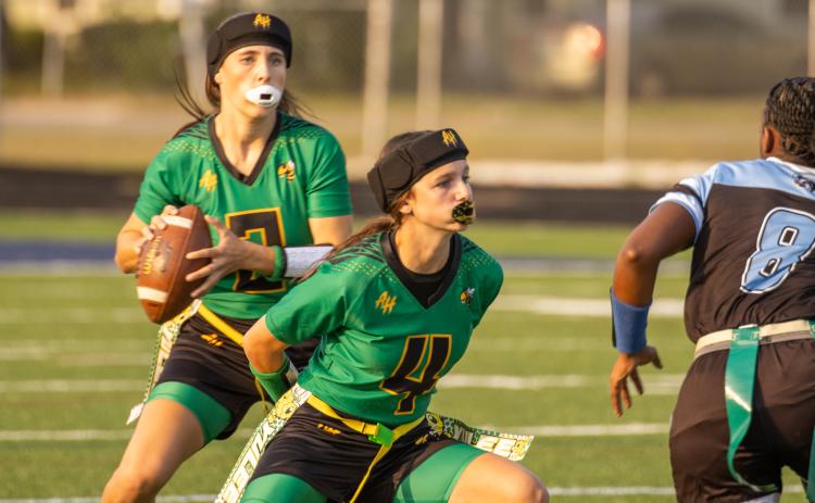 Harlow Smith screen blocks for quarterback Brooke Reid in Tuesday’s district game against Ribault. Photo by Nick Blank/News-Leader