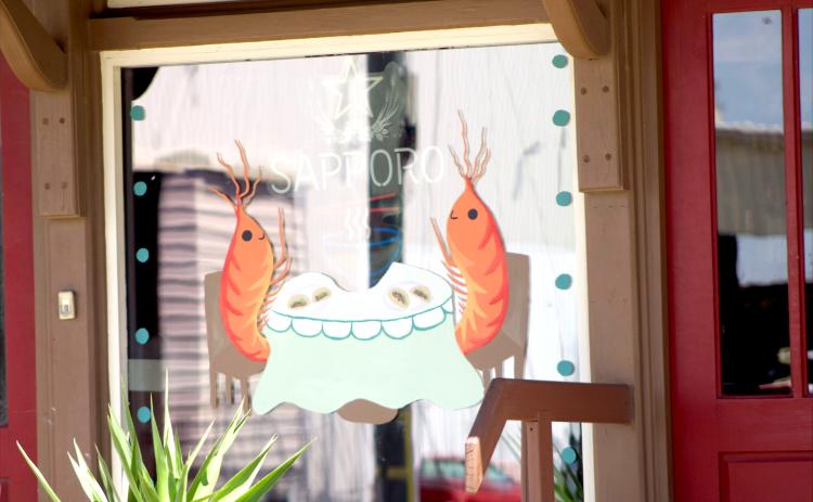 Art work painted by the FBHS National Art Honor Society on the downtown businesses as part of their annual fundraiser with the Fernandina Beach Main Street organization. By Marisa DeMar News-Leader
