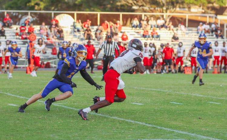Fernandina Beach High School Junior Beckham Rohe makes a tackle in a game against Fort White in the 2025-26 season. Rohe earned First Team Defense, All SSAA Atlantic; and Second Team Defense, All Northeast Florida. Photo by Ashley Chandler/News-Leader