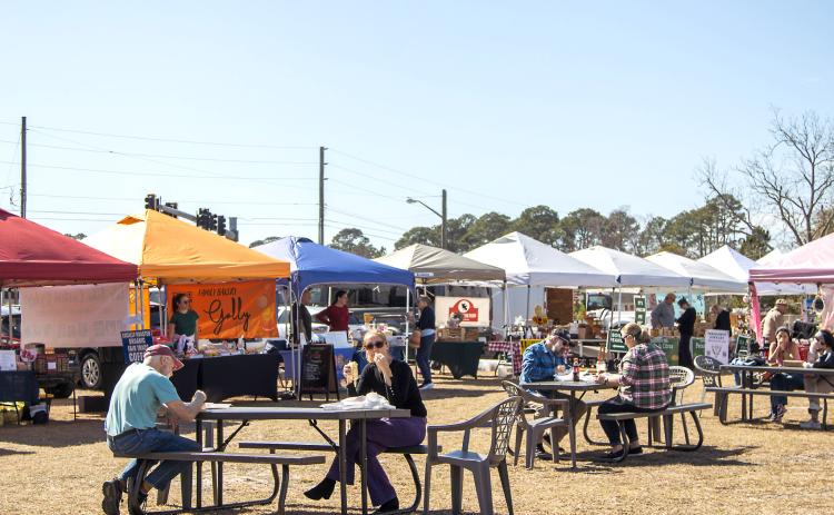 Visitors at the Midweek Farmers Market in Fernandina Beach earlier this year. The market is on a hiatus while parking requirements are sorted out. Photo by Ashley Chandler/News-Leader