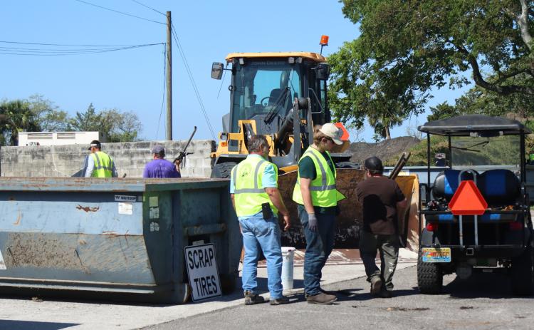 Volunteers and Clean Harbors, the company contracted for both events, help locals to unload items to discard at Saturday’s Household Hazardous Waste Collection in Fernandina Beach. Photo by Ashley Chandler/News-Leader