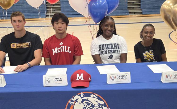 Camilla Clarke, second from right, a high school student at Bolles High School in Jacksonville, and resident of Fernandina Beach, participated in a signing ceremony Wednesday at Bolles. Clarke has committed to throw for the Howard University track and field team. Submitted photo