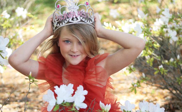 Laylah Saylor Leopold poses in her queen crown and sash which were awarded to her when she took first place in the Sunburst Pageant in Orange Park in Feb.  By Marisa DeMar/News-Leader