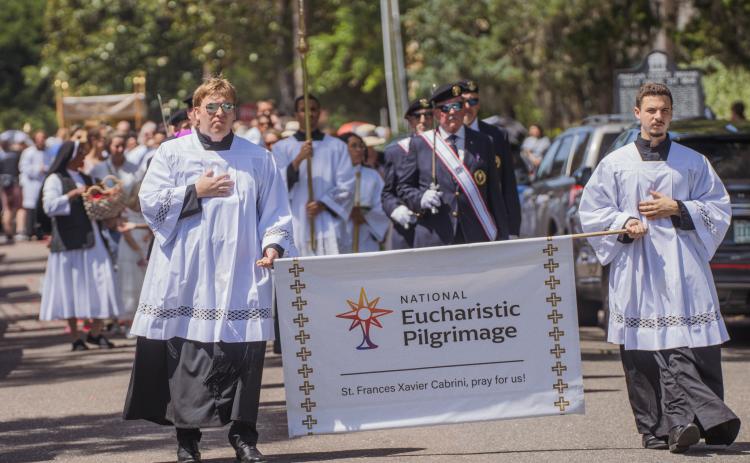 Clergy from St. Michael’s Catholic Church walk to the Fernandina Harbor Monday for the National Eucharistic Pilgrimage. Nick Blank/News-Leader 