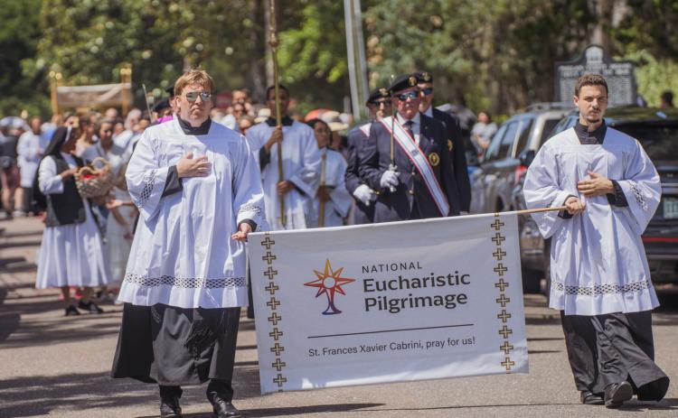 Clergy from St. Michael’s Catholic Church walk to the Fernandina Harbor Monday for the National Eucharistic Pilgrimage. Nick Blank/News-Leader 