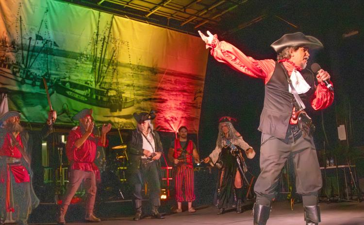 Brian Leary, also known as Swordmaster, right, on stage during the Pirate Invasion on Friday. Leary composed the music for the Pirate Club’s program. Photo by Ashley Chandler/News-Leader