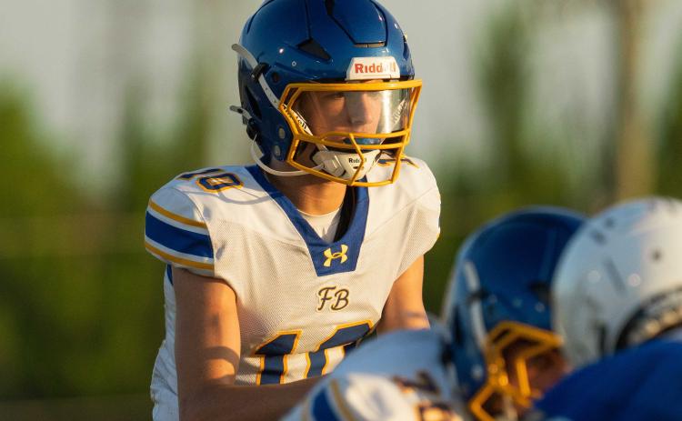Fernandina Beach High School’s quarterback Talan Van Delinder waits for the snap in Wednesday’s off-season matchup against Menendez. PHOTOS COURTESY OF MEGAN LOUISE PHOTOS