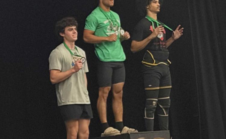 Clay Hicks, left, came in third in Traditional for the 154-pound weight class. Submitted photo