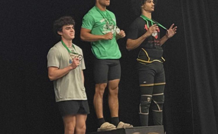 Clay Hicks, left, came in third in Traditional for the 154-pound weight class. Submitted photo