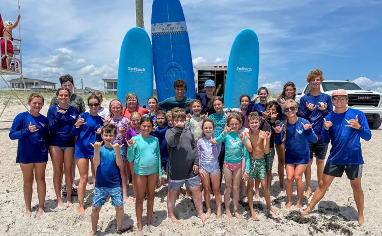 Local youth take part in the Amelia Island Surf Co. summer surf camp.  Photo by Brian Bowen
