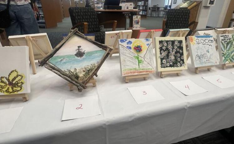 The Friends of the Library is hosting its Tiny Art! Big Fun! Art Contest, featuring more than 40 miniature works created by local artists. The exhibition is currently on display at the library and invites visitors to vote for their favorite pieces through June 26. Photo by Amy Mulligan/News-Leader
