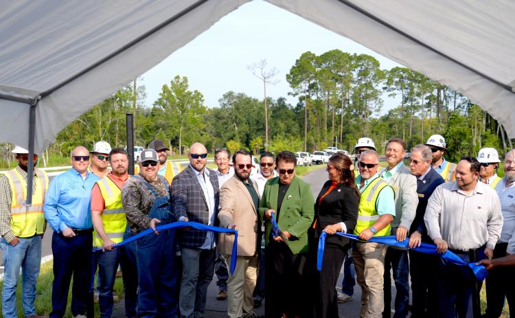 Nassau County School Superintendent Kathy Burns cuts the ribbon for Hornets Drive, formally know as William Burgess Extension. Photo courtesy of Nassau County
