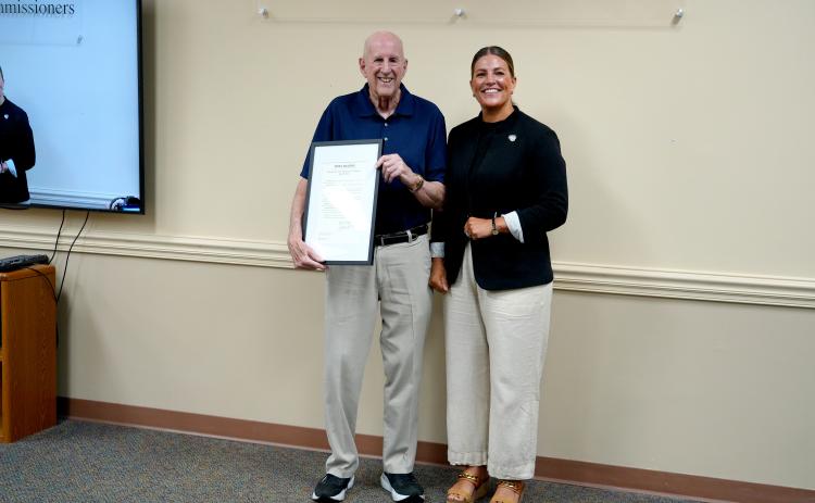 Dr. Alan Miller accepts a Proclamation on behalf of Dr. Kirkwood Adams, Jr., recognizing Dr. Adams contributions to heart failure care, medical research and professional education. Submitted photo