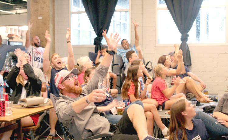 World Cup watchers at Mocama celebrate during the USA Men’s National Team’s game against on Australia on June 19. News-Leader