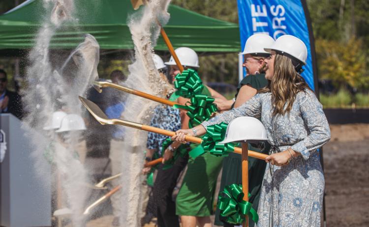 Izabelle Sala, assistant principal at Cornerstone Classic Academy in Jacksonville, right, and other academy leaders take part in a ground-breaking ceremony at the school’s new location in Wildlight. It will be the first charter school in the county. Nick Blank/News-Leader