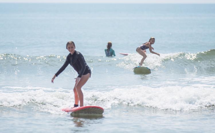 Local youth take part in the Surf Asylum clinic Monday morning on Amelia Island. Photo by Ashley Chandler/News-Leader