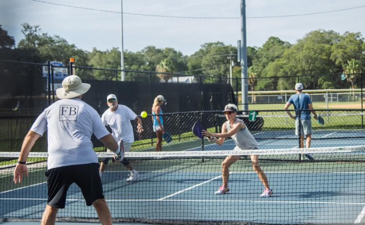 Pickleball players compete at the Fernandina Beach Central Park pickleball courts on Tuesday. Photo by Ashley Chandler/News-Leader
