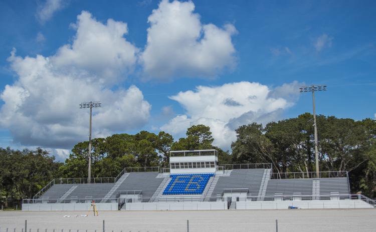 Construction of the Fernandina Beach High School stadium is nearing completion. Work continued Tuesday on the track, field and concession stand. Photo by Ashley Chandler/News-Leader