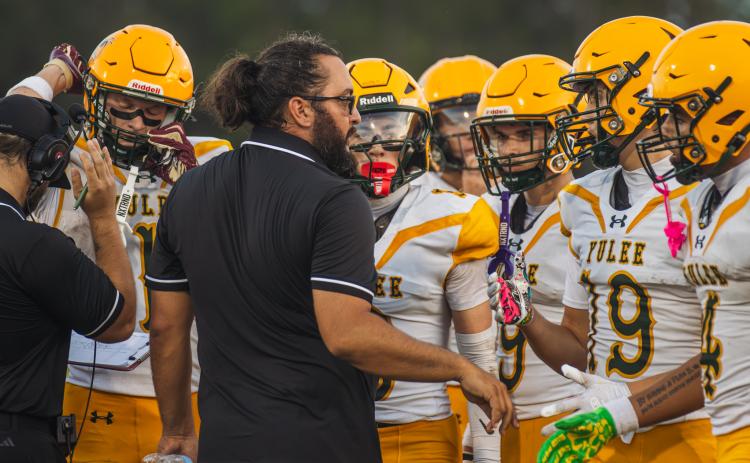 YHS Athletic Director and Head Coach Kyle Dougherty talks to Hornets players during a preseason game Aug. 14. Photo by Ashley Chandler/News-Leader