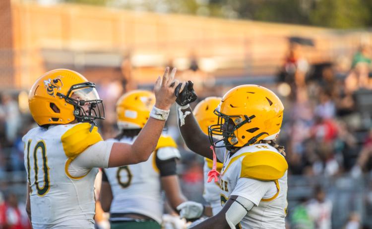 Yulee High School Quarterback Liam Hice-Jones celebrates with Duke Johnson after touchdown. Photo by Nick Blank/News-Leader