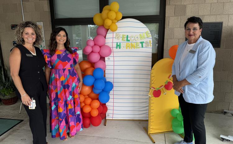 NCSD Superintendent Kathy Burns, right, greets YPS administrative staff on Monday.