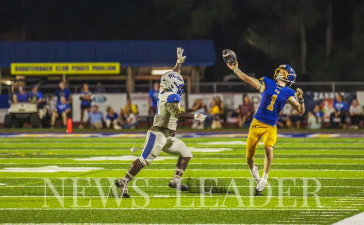 Beckham Rohe throws a pass during the home opener at Fernandina Beach High School’s upgraded stadium. Ashley Chandler/News-Leader