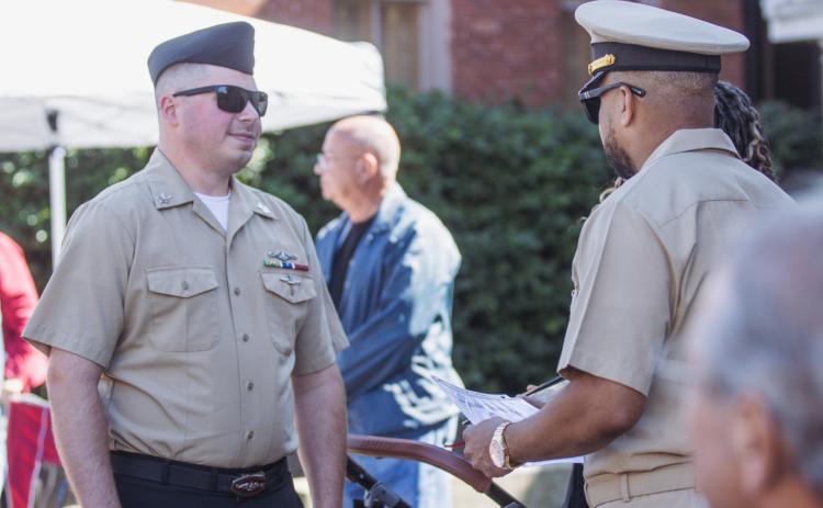 Petty Officer Michael Gregory Payne re-enlists during the 8 Flags Car show on Saturday. Photo by Ashley Chandler/News-Leader