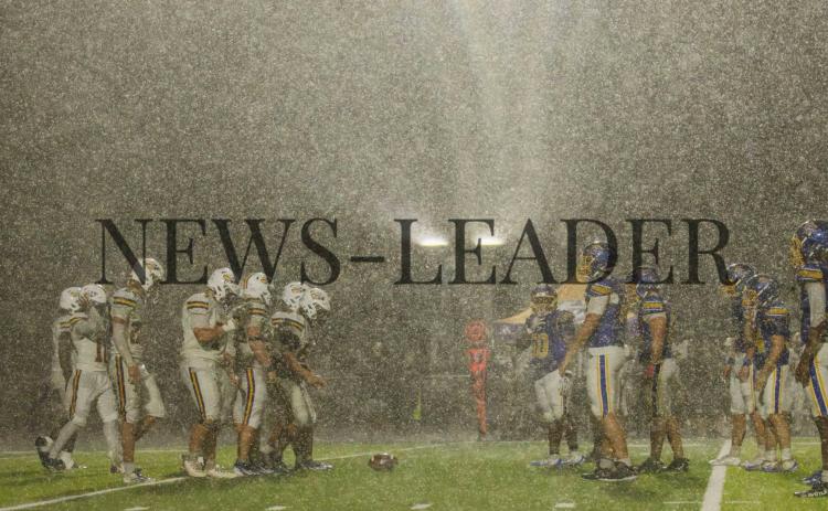 Pirates meet Union County football players at the line of scrimmage as rain pours down on Thursday night at Fernandina Beach High School stadium. Photo by Ashley Chandler/News-Leader