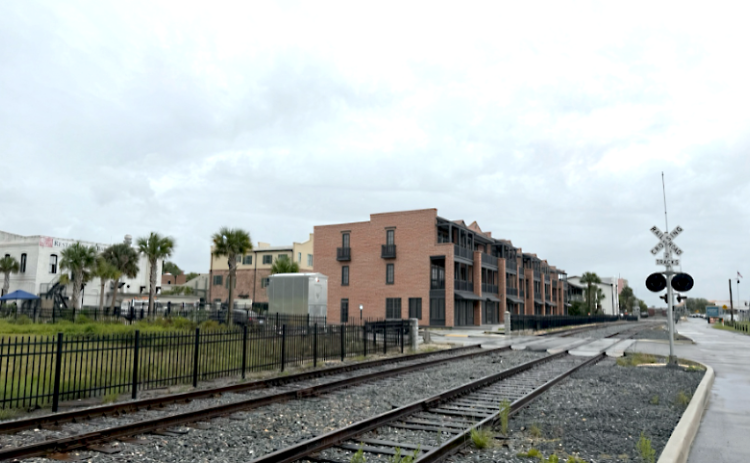 Provided image A rendering of what the townhomes are expected to look like at the corner of Alachua and Front Streets. Submitted